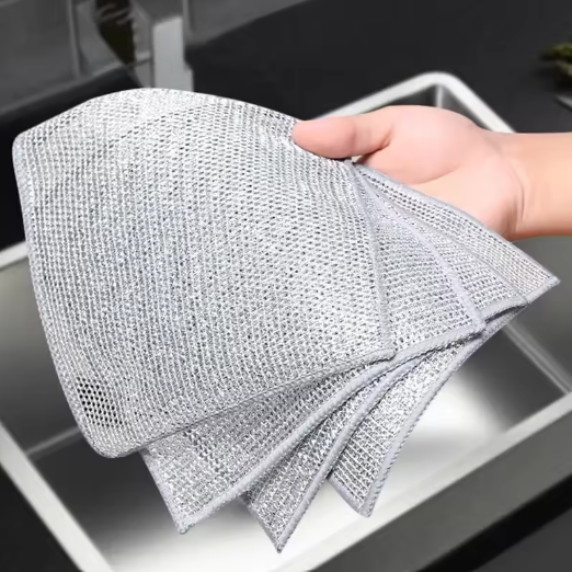 Person holding a textured Non-Scratch Dishwashing Cloth over a sink