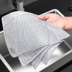 Person holding a textured Non-Scratch Dishwashing Cloth over a sink